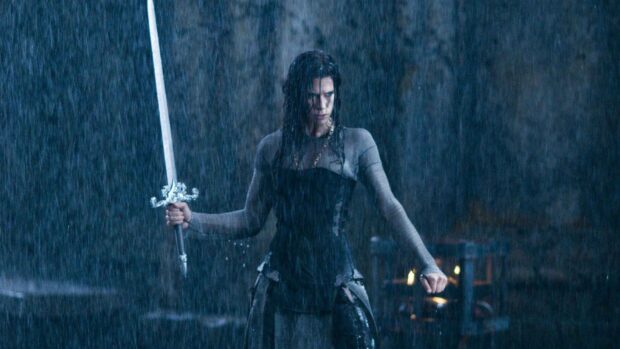 Selene stands determined with a sword in the rain scene from Underworld, HD Desktop Wallpaper
