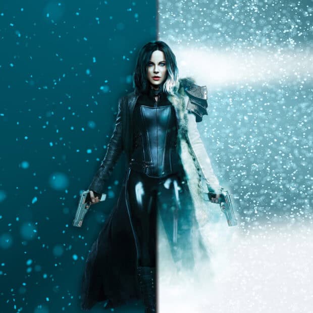 Selene stands confidently with guns in both hands in a split icy and dark scene, HD Desktop Wallpaper