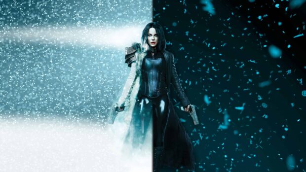 Selene stands with guns in a snowy and dark contrasting scene, 4K Desktop Wallpaper