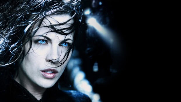 A close up of Selene with intense blue eyes in a dark setting, HD Desktop Wallpaper