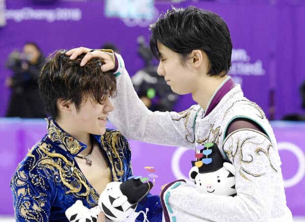 Shoma Uno is congratulated after a performance holding a mascot, HD Desktop Wallpaper