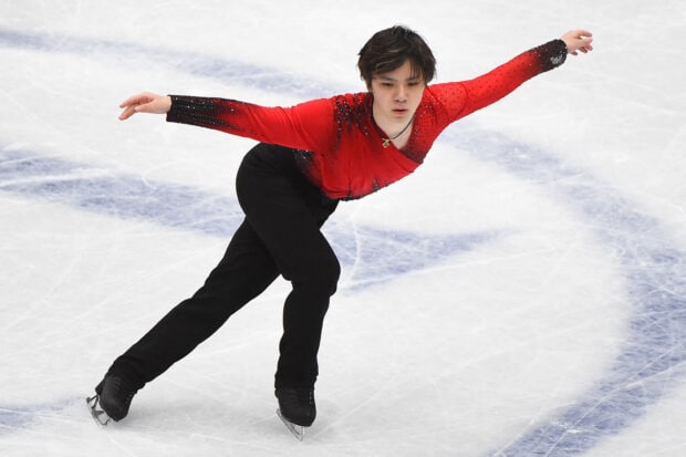 Shoma Uno is performing a figure skating routine on ice, HD Desktop Wallpaper