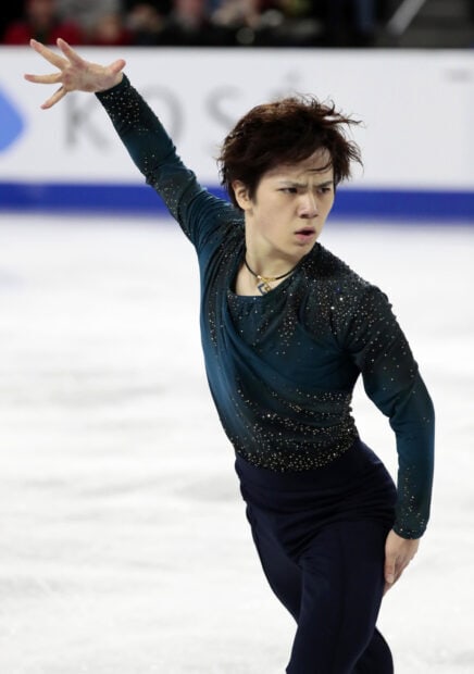 Shoma Uno performing an expressive figure skating routine on ice, HD Mobile Wallpaper