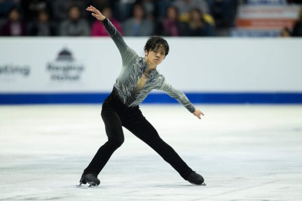 Shoma Uno performs a graceful figure skating routine on the ice, HD Desktop Wallpaper