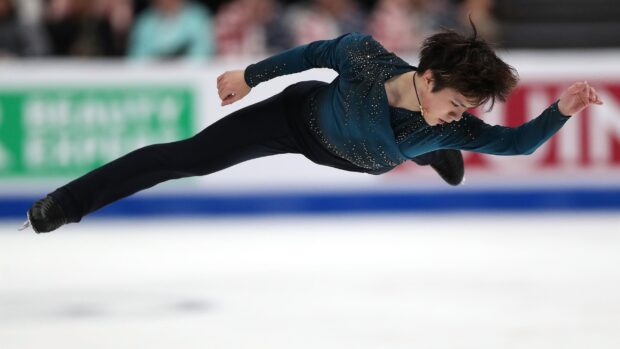 Shoma Uno performs a powerful jump during an ice skating routine, 2K Desktop Wallpaper