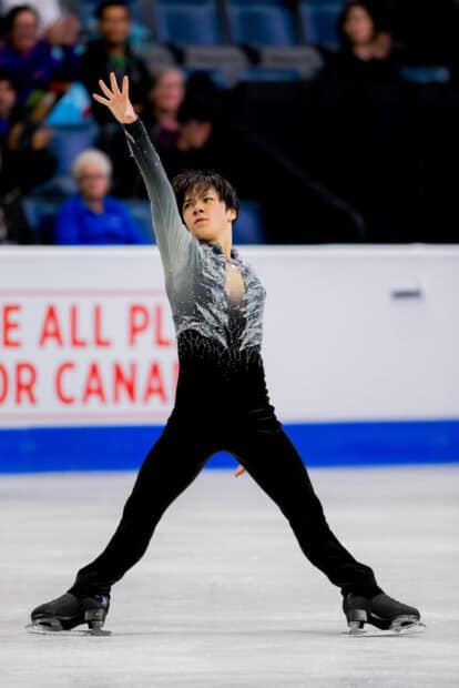 Shoma Uno performs a striking pose during a figure skating event, HD Desktop Wallpaper