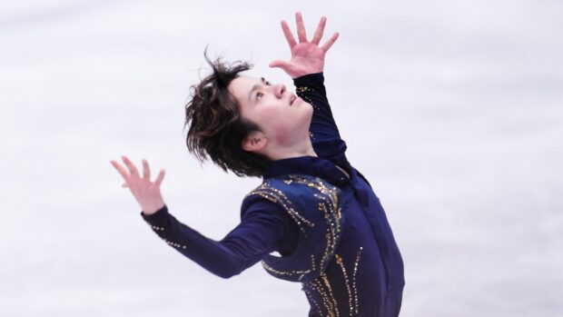 Shoma Uno is captured mid performance with expressive arms and focused gaze, 2K Desktop Wallpaper