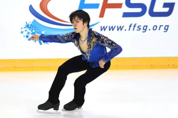 Shoma Uno is concentrating during his figure skating routine on the ice rink, HD Desktop Wallpaper