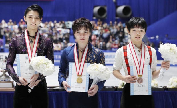 Shoma Uno wallpapers standing with medals and flowers after competition, HD Desktop Wallpaper