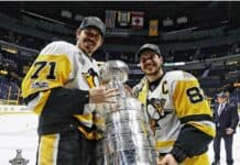 Sidney Crosby celebrates winning the Stanley Cup with teammate on ice rink, HD Desktop Wallpaper