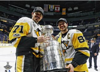 Sidney Crosby celebrates winning the Stanley Cup with teammate on ice rink, HD Desktop Wallpaper