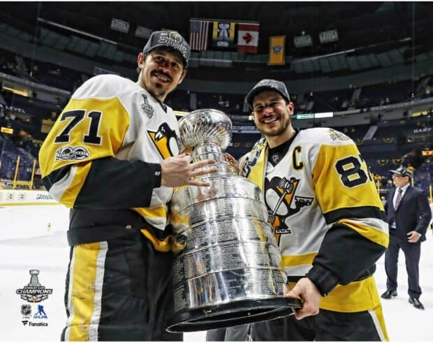 Sidney Crosby celebrates winning the Stanley Cup with teammate on ice rink, HD Desktop Wallpaper
