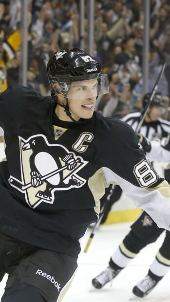 Sidney Crosby is celebrating a goal wearing a black hockey jersey, 2K Mobile Wallpaper