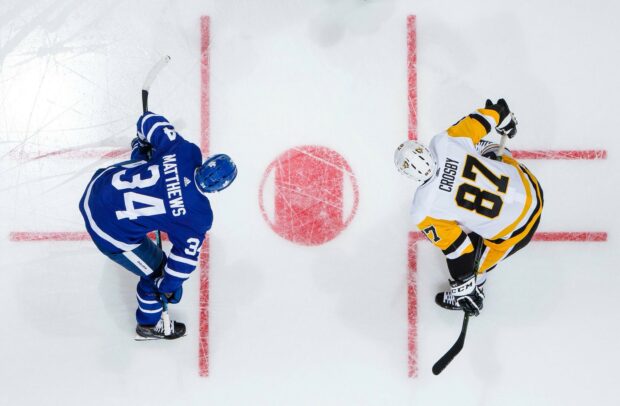Sidney Crosby faces opponent during ice hockey faceoff at center, HD Desktop Wallpaper