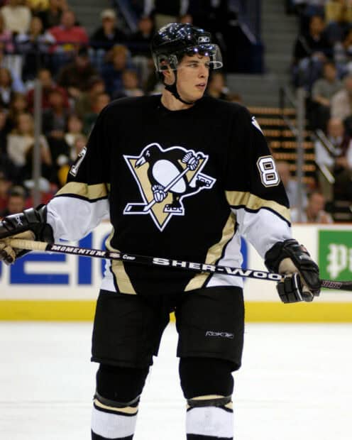 Sidney Crosby in action during a hockey game wearing the Pittsburgh Penguins jersey, HD Desktop Wallpaper