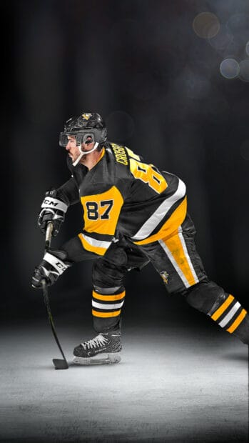 A hockey player named Sidney Crosby prepares to strike the puck on ice, HD Phone Wallpaper