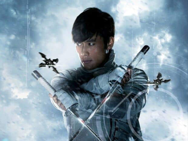 A warrior gripping swords stands ready in cold mist from Gi Joe Movie Wallpapers, 2K Desktop Wallpaper