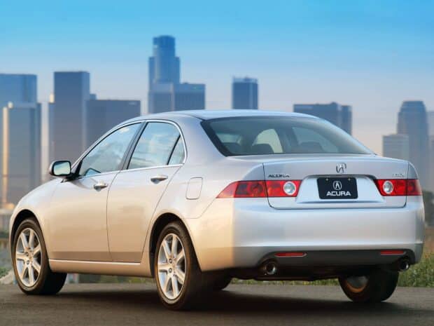 A silver Acura sedan is parked in front of a city skyline under a clear blue sky featuring Honda Accord wallpapers, HD Desktop Wallpaper