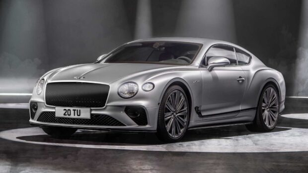 A silver Bentley Continental GT is shown in a modern studio setting with focused lighting, HD Desktop Wallpaper