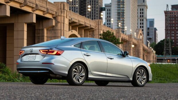 A sleek modern sedan with city buildings, Honda Insight Wallpapers, HD Desktop Wallpaper
