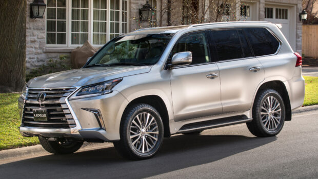 A silver Lexus LX is parked on a suburban street near a house with vintage windows, 4K Desktop Wallpaper