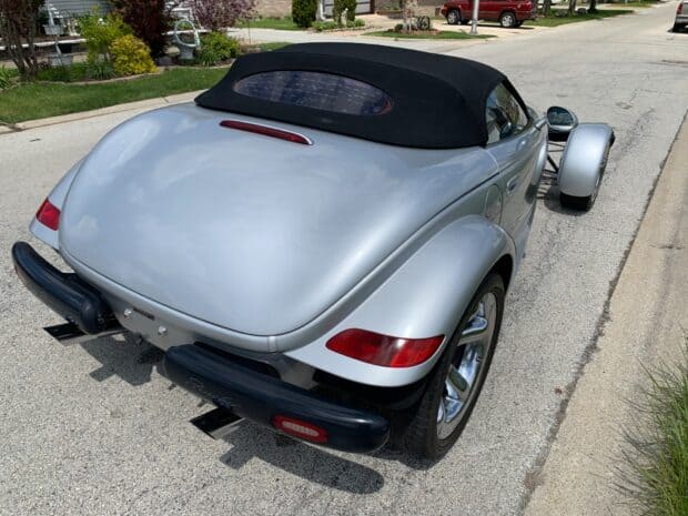 A silver Plymouth Prowler is parked on a residential street with its distinctive rear design clearly visible, HD PC Wallpaper