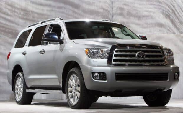 A silver Toyota Sequoia SUV is parked with detailed front grill and tires, 2K Desktop Wallpaper