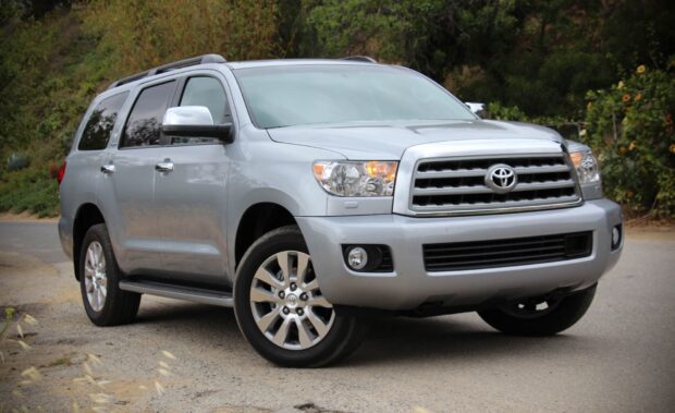 A silver Toyota Sequoia is parked on a countryside road surrounded by greenery, HD Desktop Wallpaper