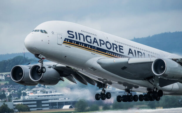 A Singapore Airlines Airbus A380 is captured during takeoff over airport grounds, HD Desktop Wallpaper