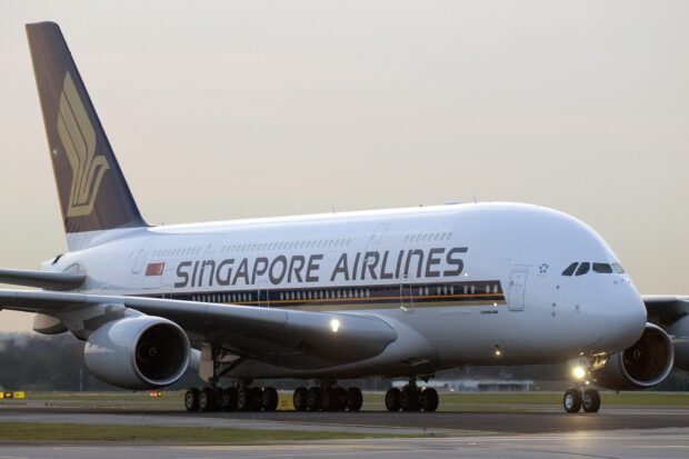 A Singapore Airlines Airbus A380 aircraft is taxiing on the runway during sunset, HD Desktop Wallpaper