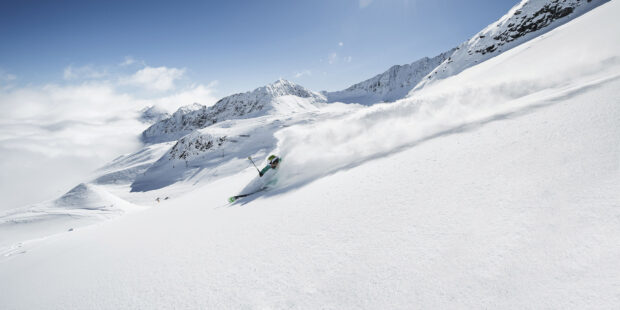 A skier moves swiftly down snow covered mountain slopes with skiing wallpapers, HD Desktop Wallpaper