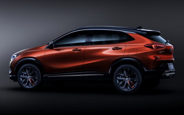 A sleek metallic red Buick Encore showcasing its modern design, HD Desktop Wallpaper