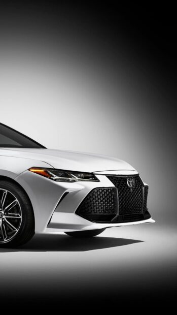 A white Toyota Avalon is showcased with a bold front grille and sharp headlights, 2K Phone Wallpaper