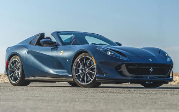A dark blue Ferrari 812 Gts convertible is parked outdoors on a sunny day, HD Desktop Wallpaper
