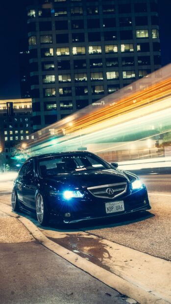 A sleek Honda Accord shines with bright headlights parked by a city street at night, 2K Phone Wallpaper