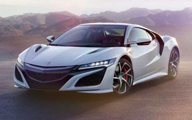 A sleek silver Honda NSX is parked on a road with mountain scenery in the background, HD Desktop Wallpaper