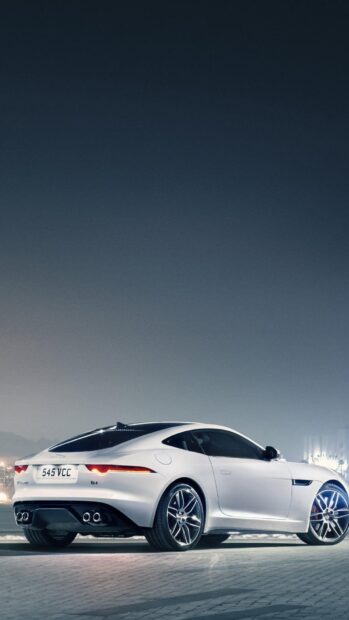 A white Jaguar F Type car parked on a city street at night, HD Phone Wallpaper