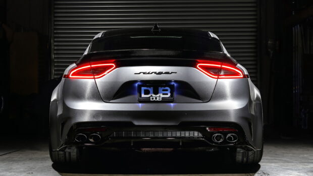 The sleek Kia Stinger shows its distinctive rear lights and sporty design, 2K Desktop Wallpaper