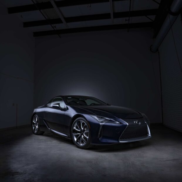 A sleek Lexus LC luxury coupe is showcased in a low light indoor environment highlighting its design, HD Desktop Wallpaper