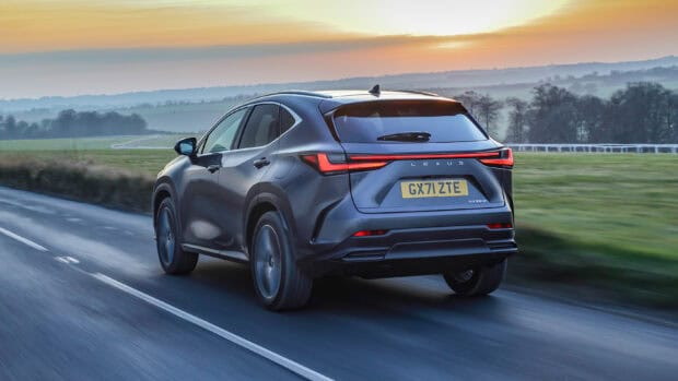 A sleek Lexus Nx driving on a rural road during sunset with hills in the background, 2K Desktop Wallpaper