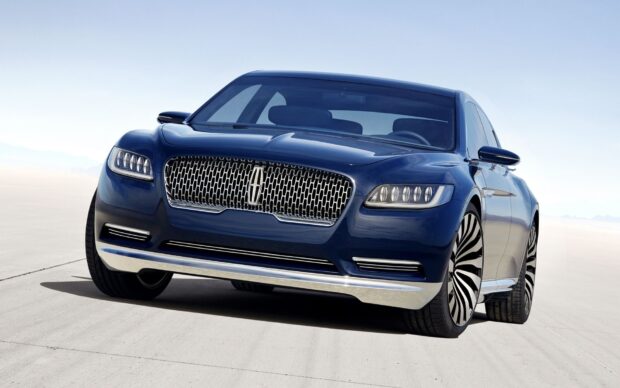 A sleek blue Lincoln car is parked under a clear sky on a concrete surface, HD Desktop Wallpaper