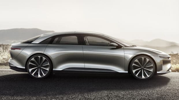 A silver Lucid Motors car is parked on a road with mountains in the background, HD Desktop Wallpaper