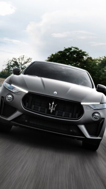 The Maserati Levante displays a sleek front design with prominent grille and headlights, HD Mobile Wallpaper