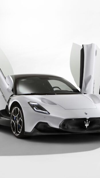 A white Maserati MC20 with gullwing doors open on a studio floor, 2K Mobile Wallpaper