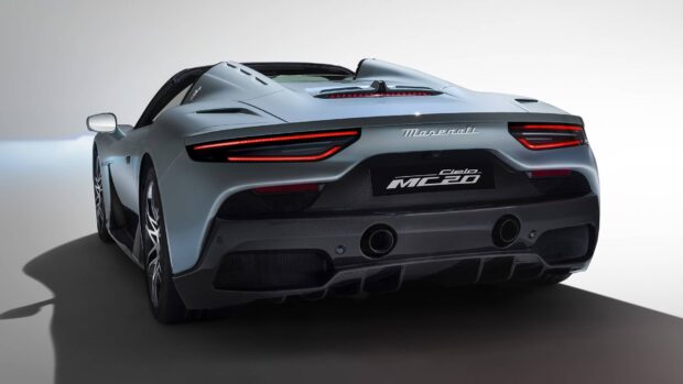 The Maserati MC20 showcases a sleek rear design with distinctive tail lights and carbon fiber details, HD Desktop Wallpaper