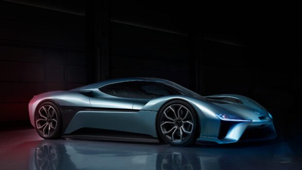 A sleek Nio Auto car is parked inside a dark garage highlighting its smooth curves and details, 4K Desktop Wallpaper
