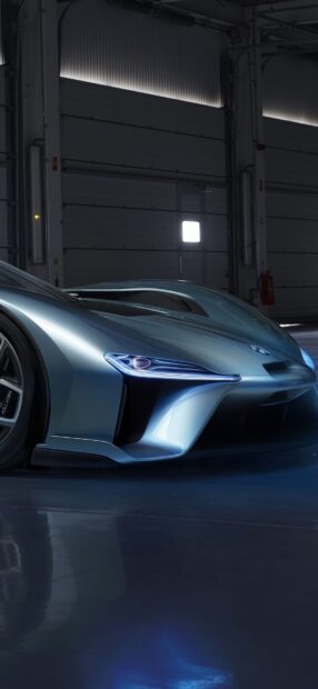 A sleek Nio Auto with sharp headlights inside a dimly lit garage, HD Mobile Wallpaper