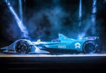 The Nio auto wallpapers show a sleek blue electric race car under dramatic lighting, 4K Desktop Wallpaper