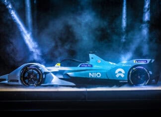 The Nio auto wallpapers show a sleek blue electric race car under dramatic lighting, 4K Desktop Wallpaper