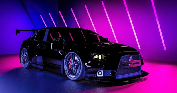 A black Lancer Evo car is illuminated by purple and pink neon lights in a modern setting, HD Desktop Wallpaper
